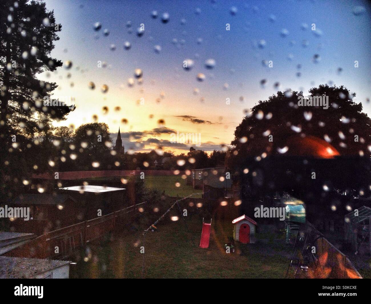 Looking out through a window covered in raindrops. - Smartphone Captured Stock Image