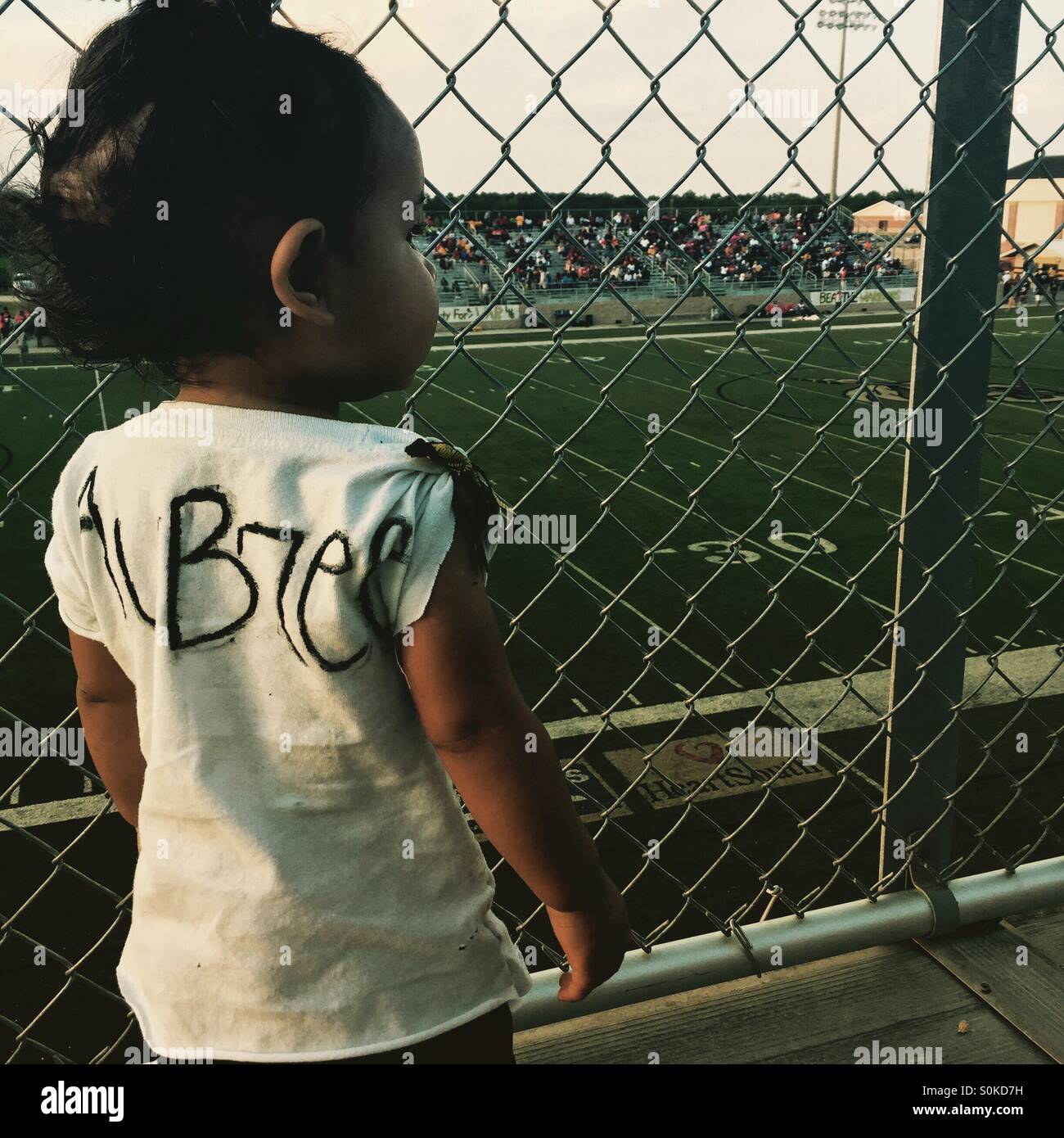 My daughter's first football game. Stock Photo