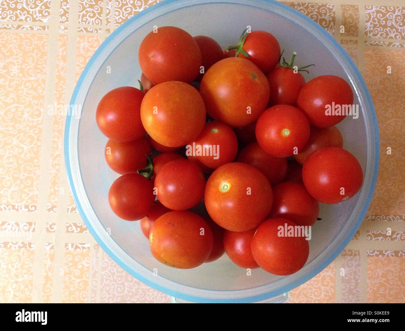 red tomatos in basket Stock Photo