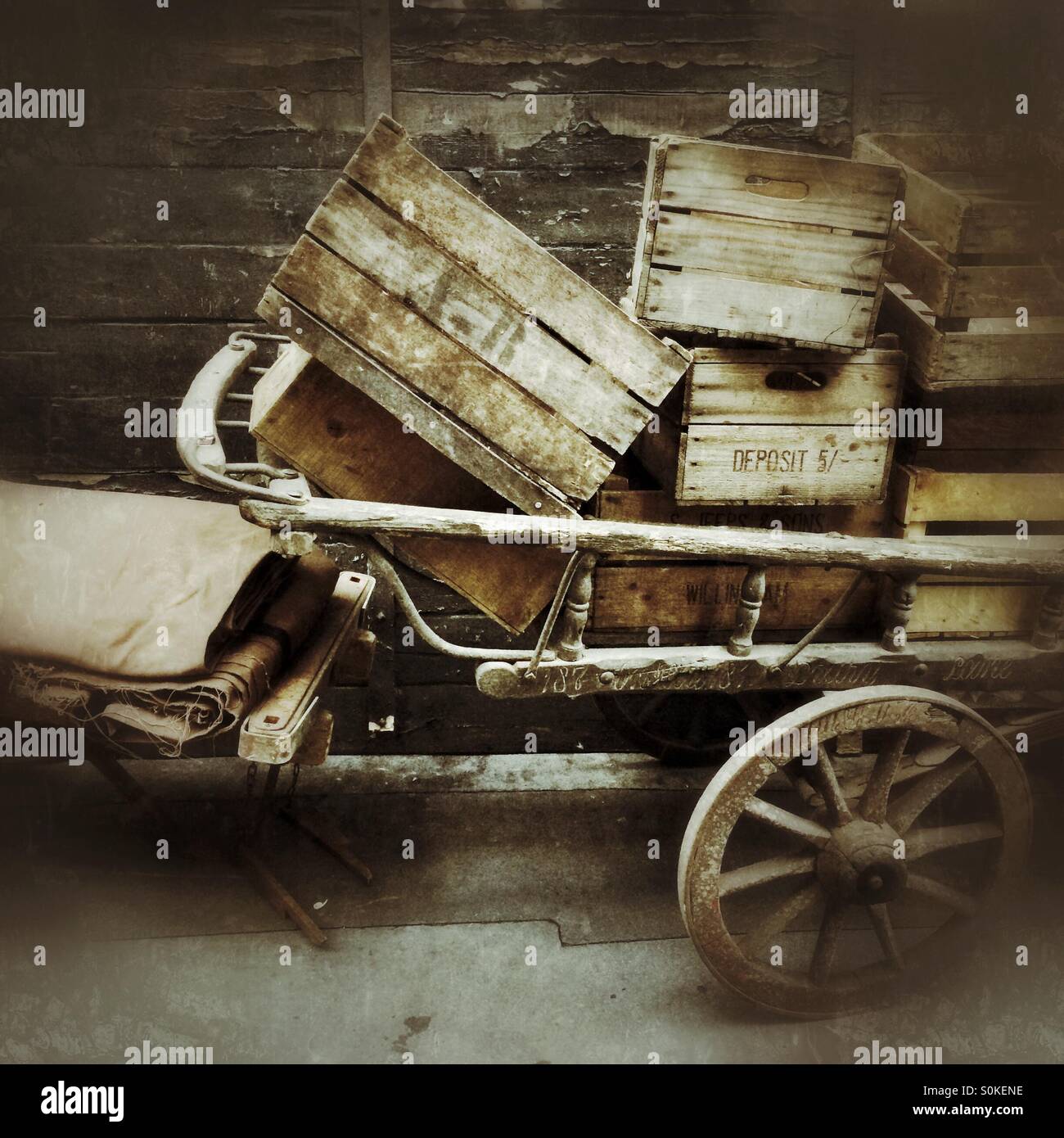 An old wooden cart filled with wooden boxes - Smartphone Captured Stock Image