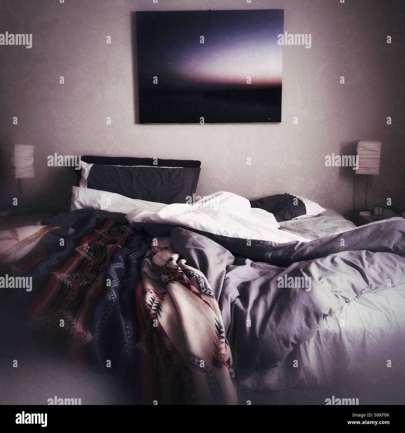 unmade bed in modern apartment - Smartphone Captured Stock Image