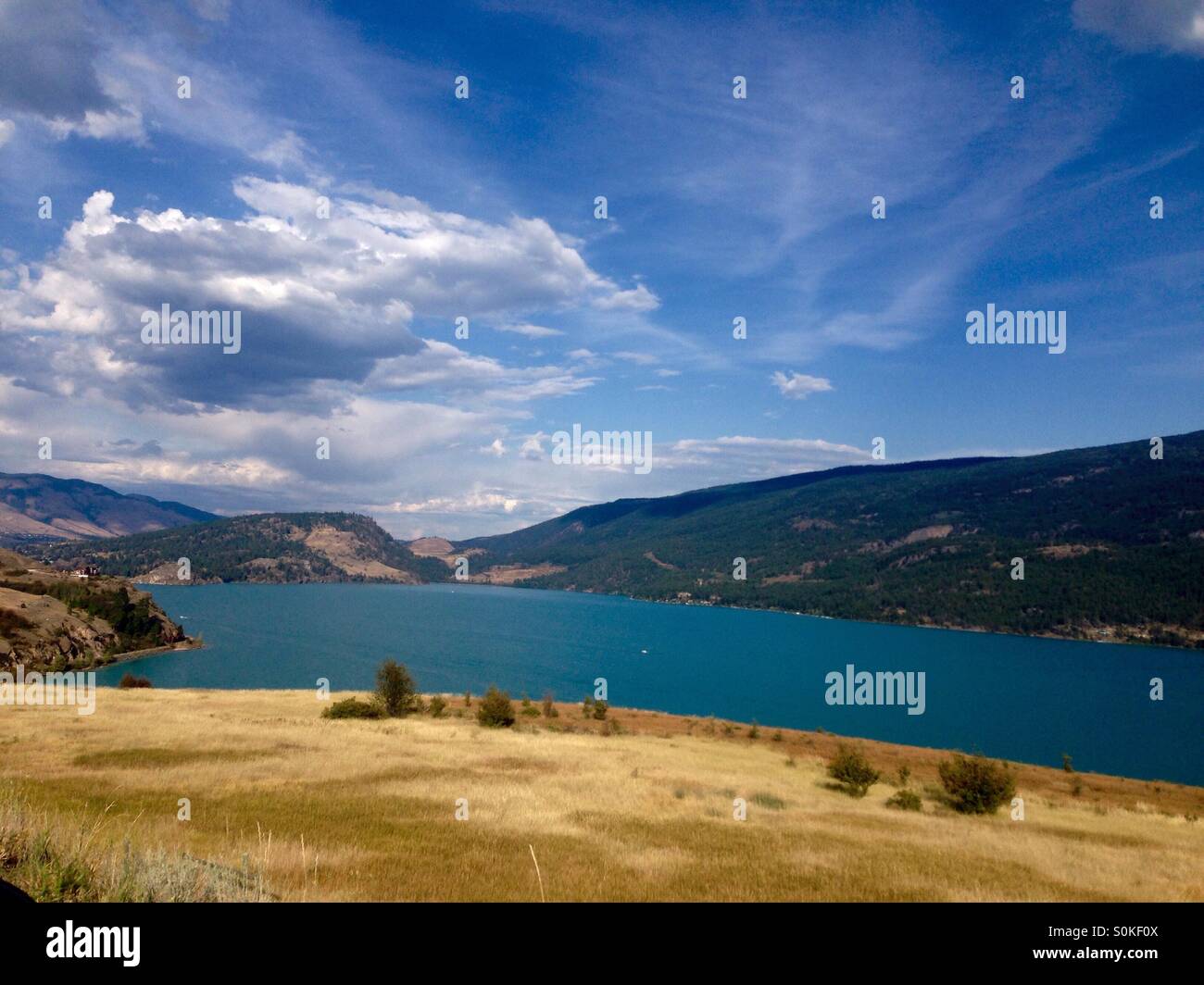 Kelowna lake and hills on a hot dry summer day in British Columbia Canada Stock Photo