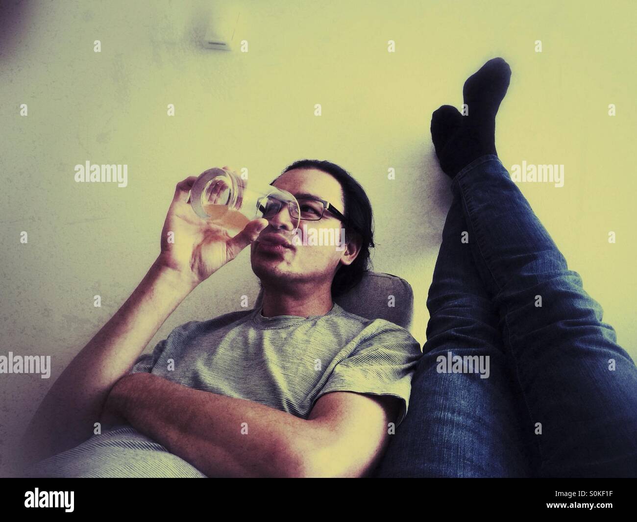 Couple relaxing at home - Smartphone Captured Stock Image