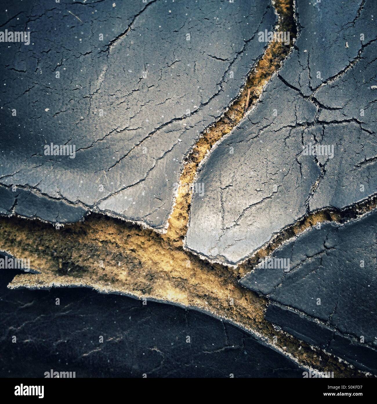 Cracked motor scooter seat - Smartphone Captured Stock Image