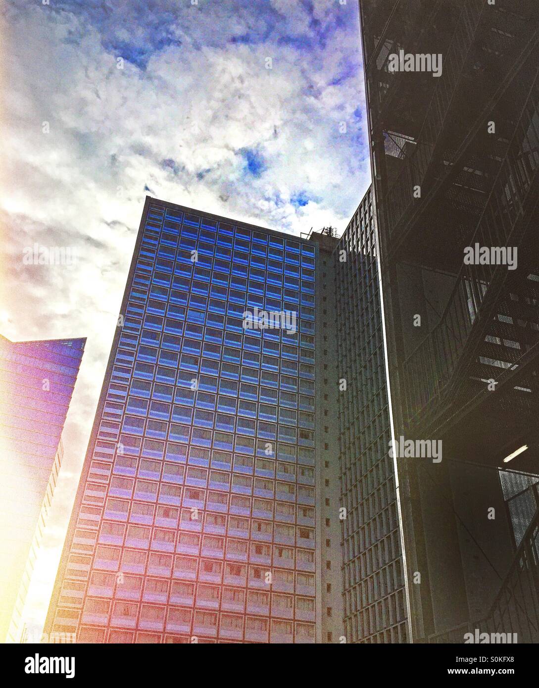 Sun rising between office buildings - Smartphone Captured Stock Image