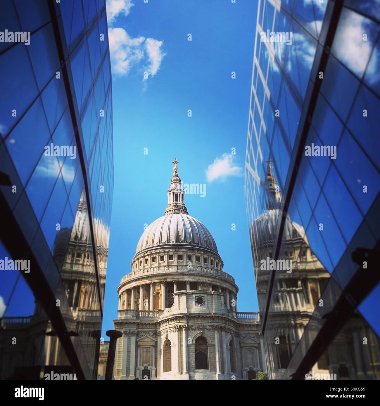 The dome of St Paul's Cathedral sandwiched between the modern One New Change development Stock Photo
