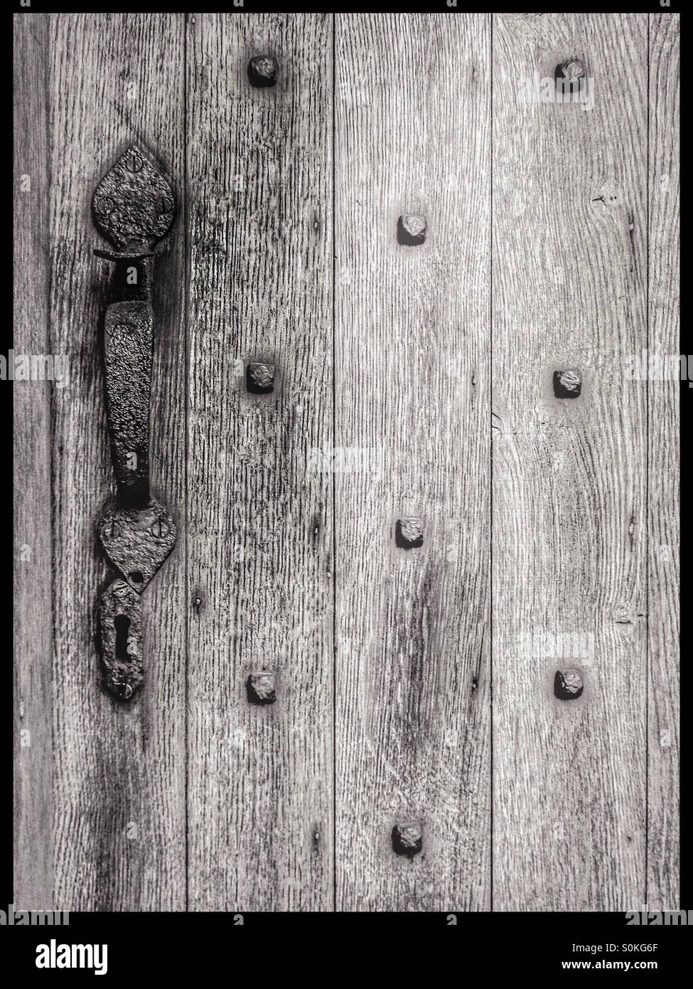 Studded wooden, weathered medieval door - Smartphone Captured Stock Image