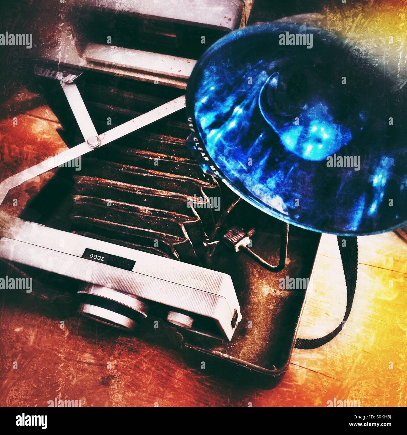 An old camera and blue flashgun - Smartphone Captured Stock Image