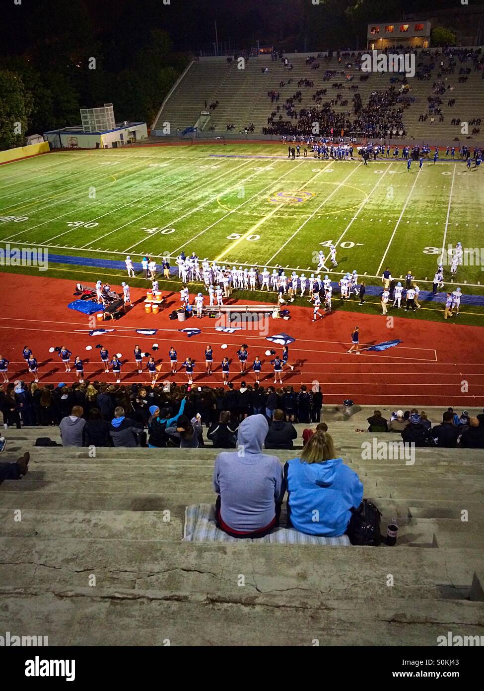 Stadium High School hosts a football game against Gig Harbor High School on an early fall evening. Stock Photo