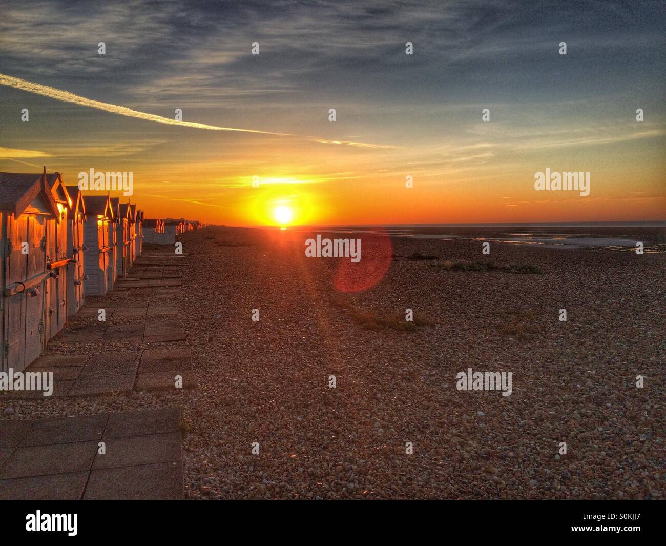 Colourful sunrise on beach Stock Photo