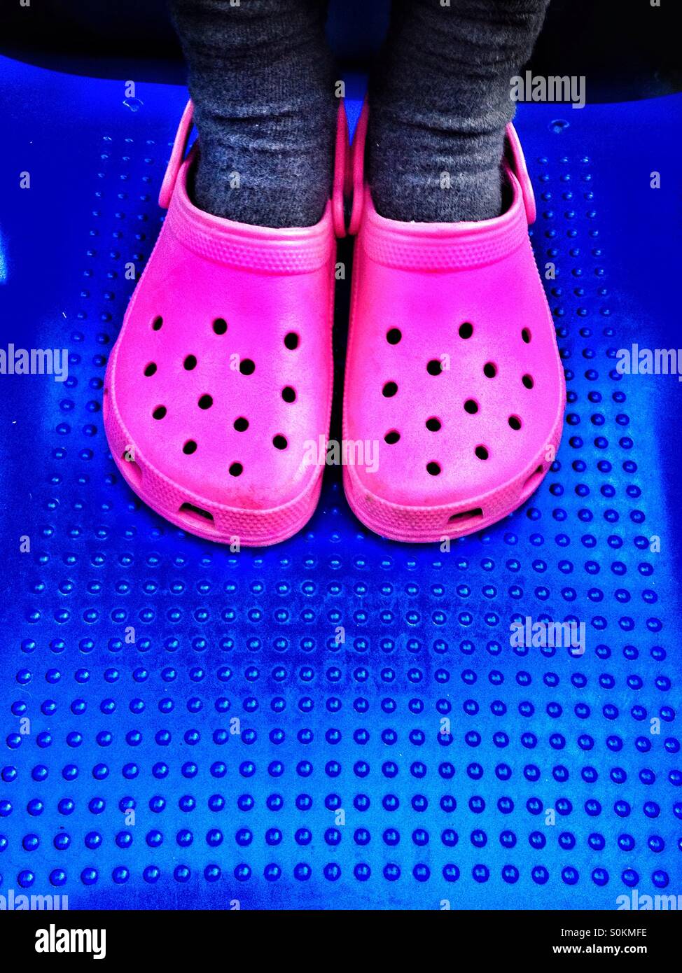 Pink shoes on blue background Stock Photo
