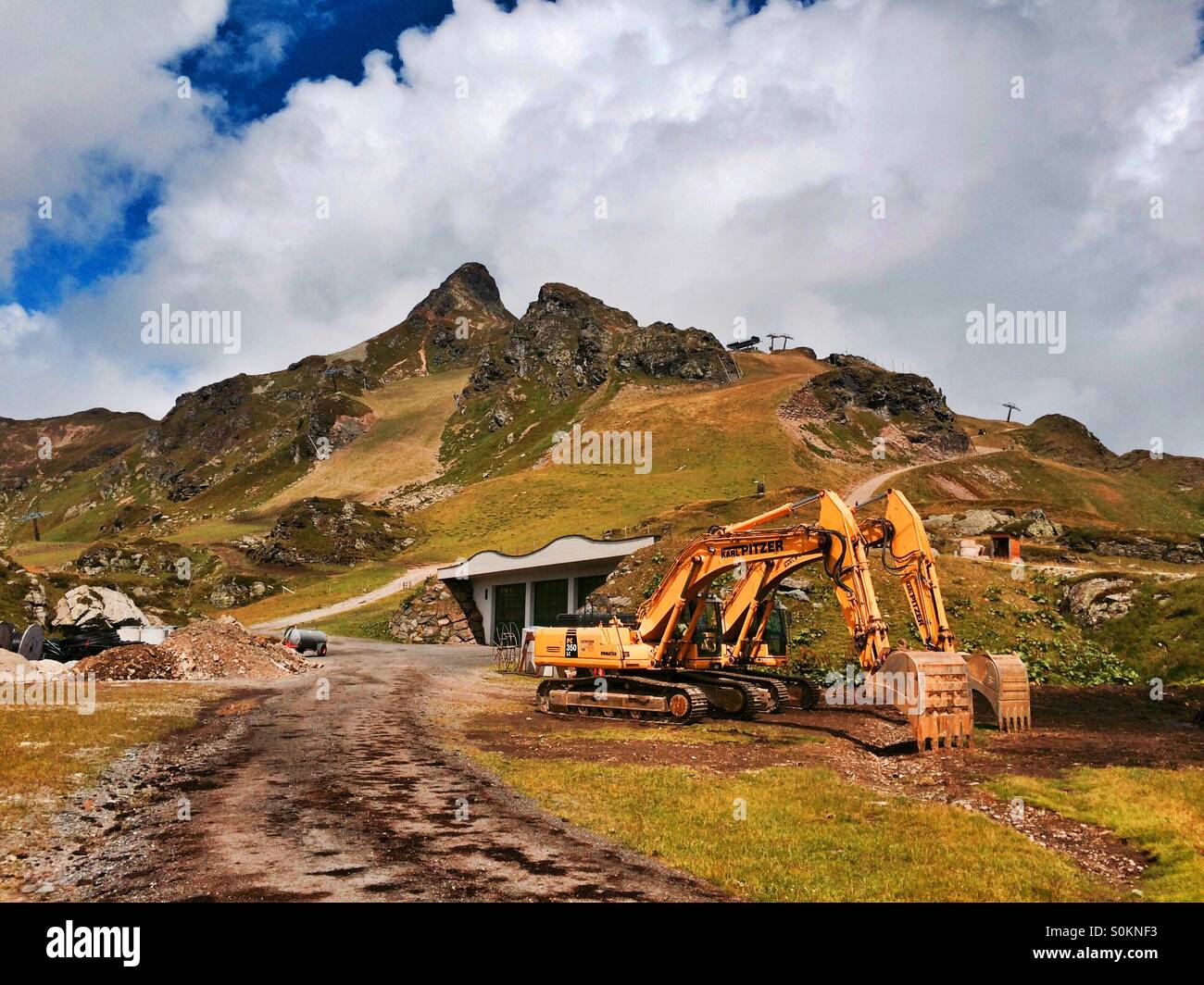 Two excavators in Obertauern ski resort in summer, Austria Stock Photo