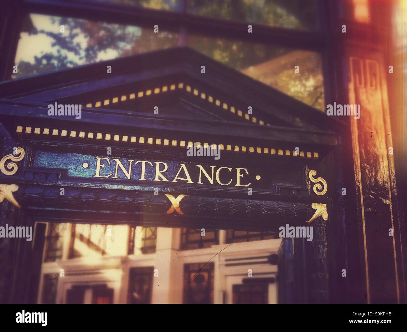 Entrance sign above door - Smartphone Captured Stock Image