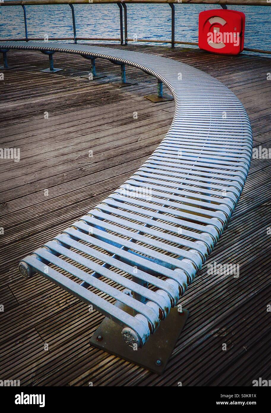Curved seating and a lifebelt - Smartphone Captured Stock Image