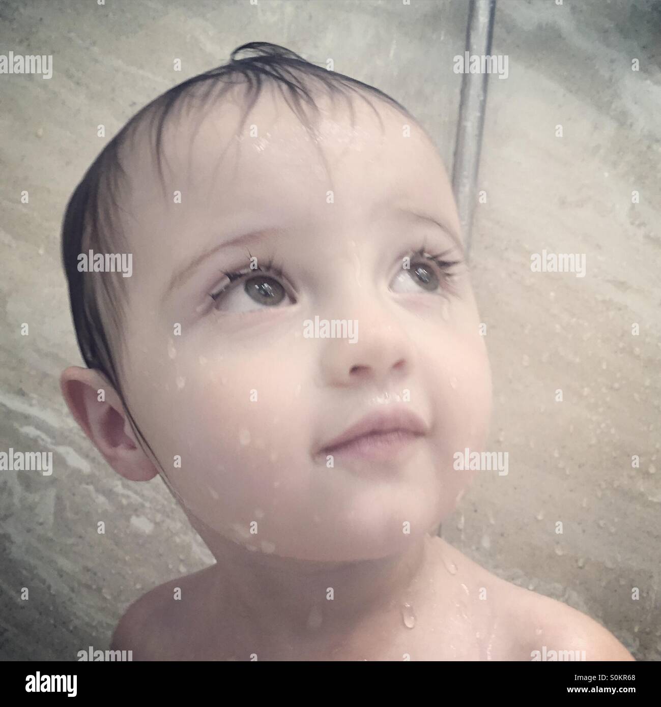 Baby close-up in shower Stock Photo