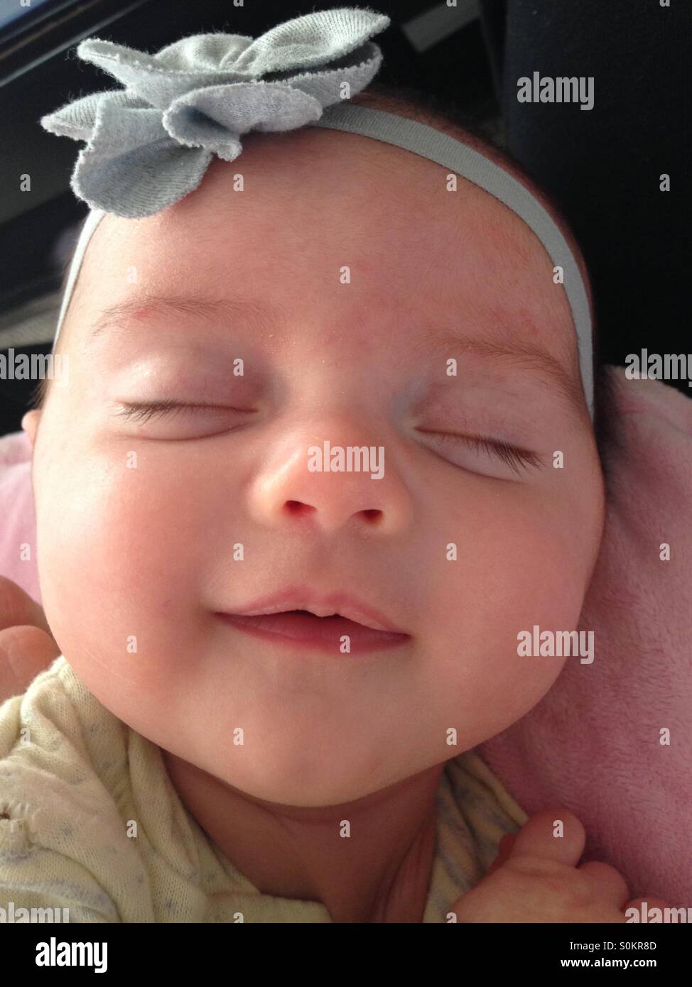 Smiling newborn baby Stock Photo