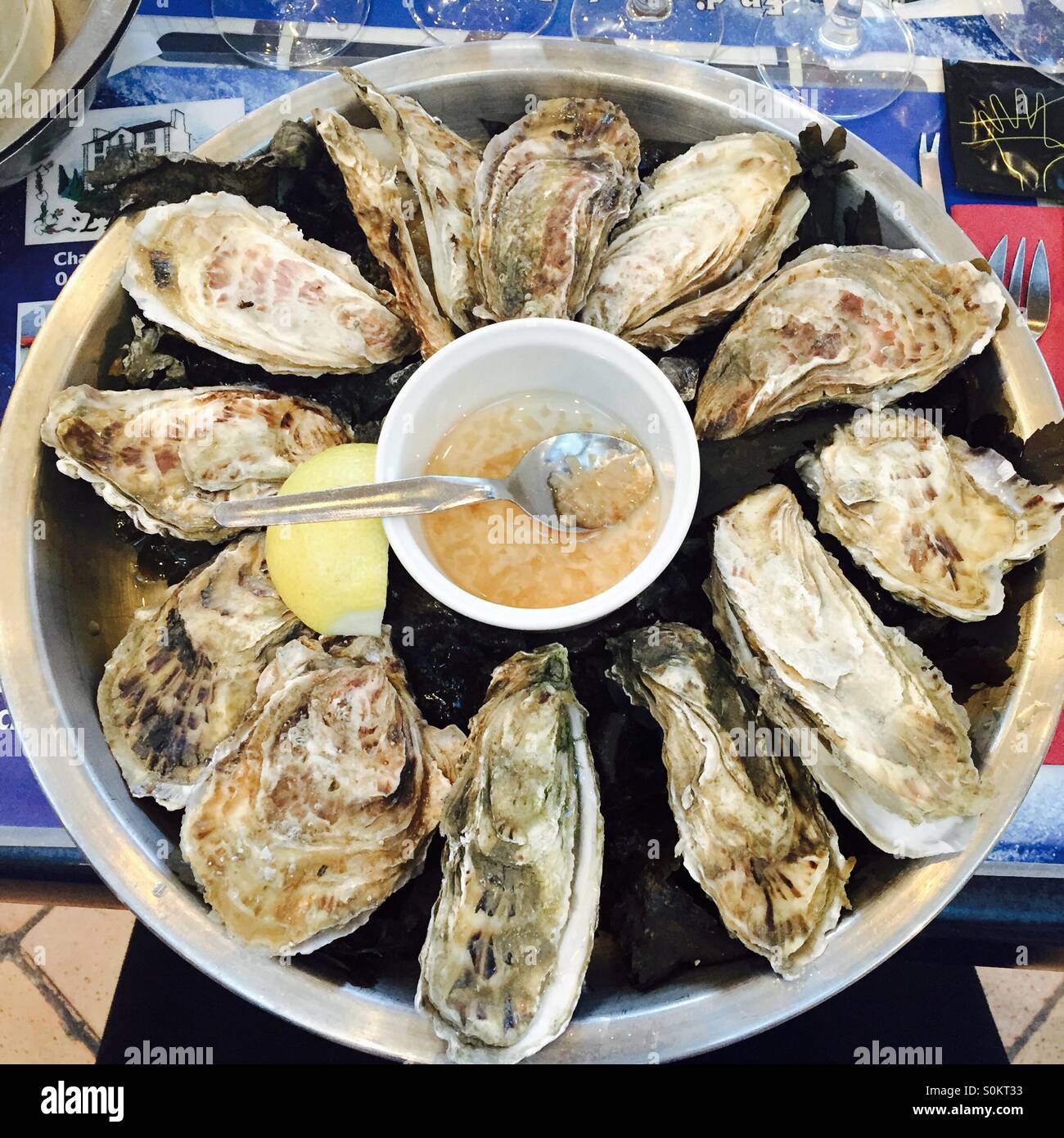 Oysters with lemon and sauce Stock Photo Alamy