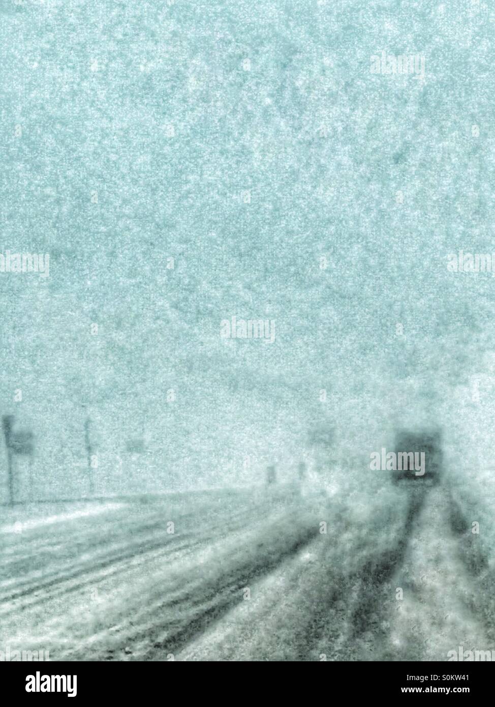 White out conditions on icy road Stock Photo