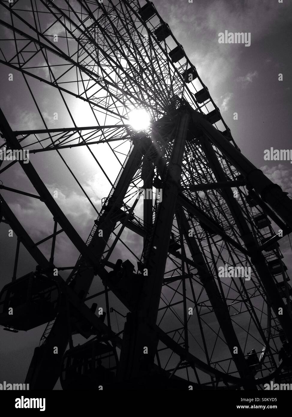 Big wheel in front of sunlight - Smartphone Captured Stock Image