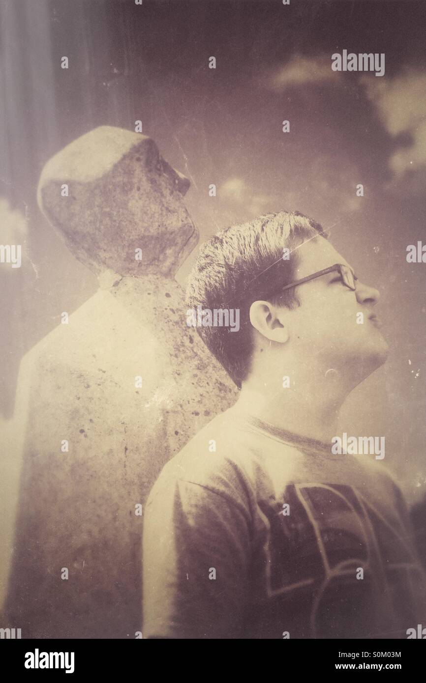 A young man with a stone shadow and a vintage texture Stock Photo - Alamy