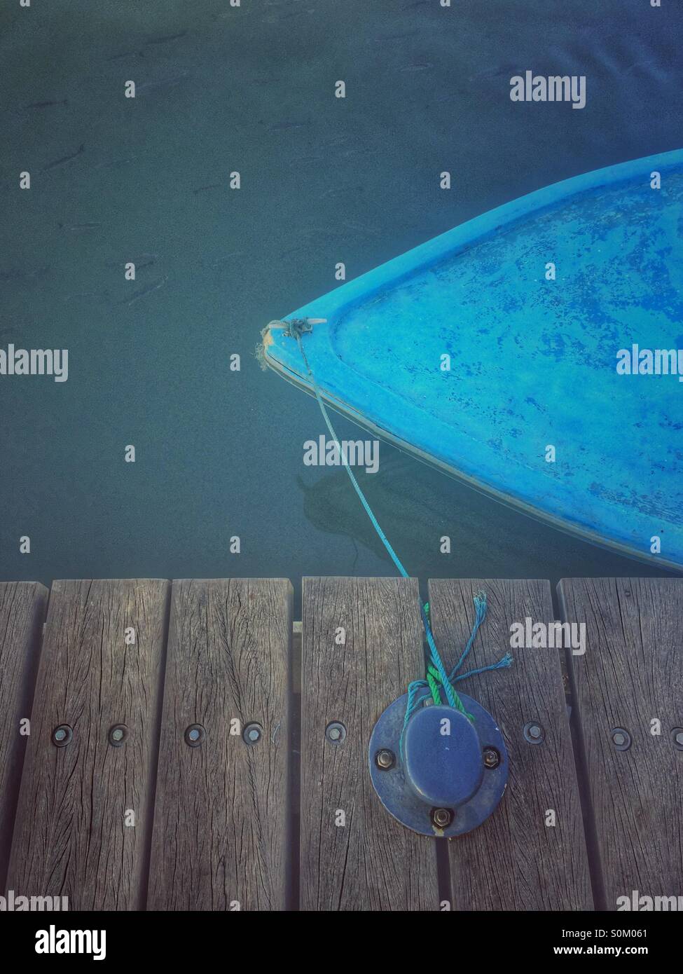 Moored boat by the pier Stock Photo - Alamy