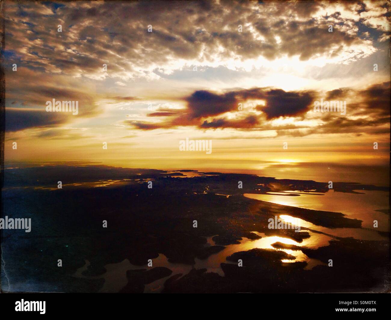 Aerial view of Sydney waterways from plane at sunrise - Smartphone Captured Stock Image