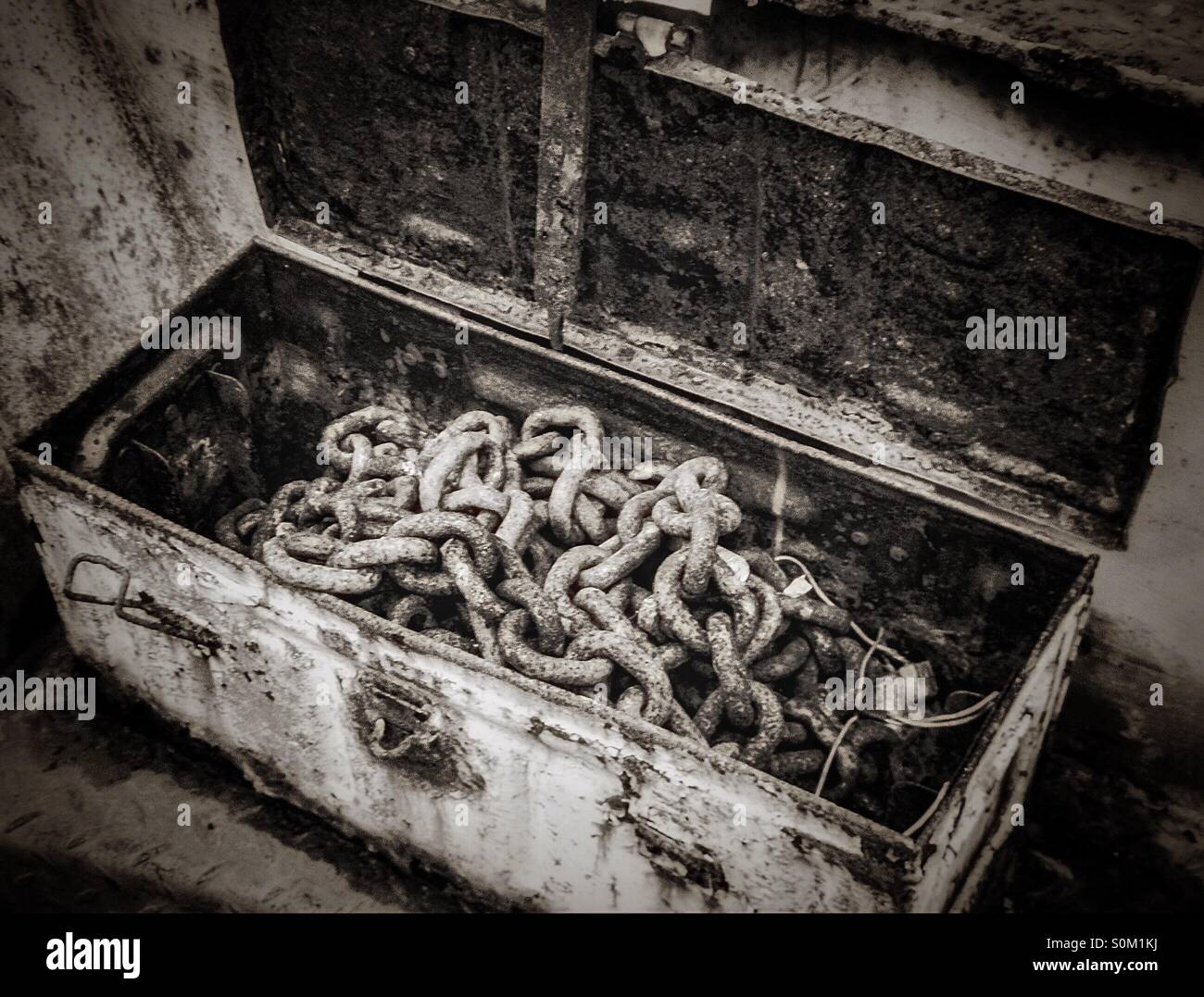 Old box with rusting chains - Smartphone Captured Stock Image