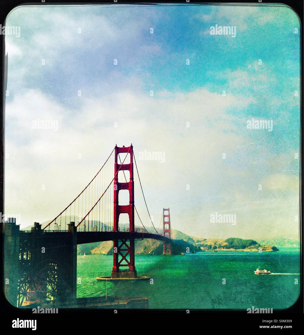 Golden Gate Bridge on a sunny San Francisco day with ferry on bay Stock ...