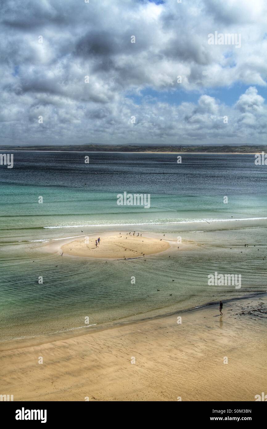A sandbank  appears as the tide goes out. - Smartphone Captured Stock Image