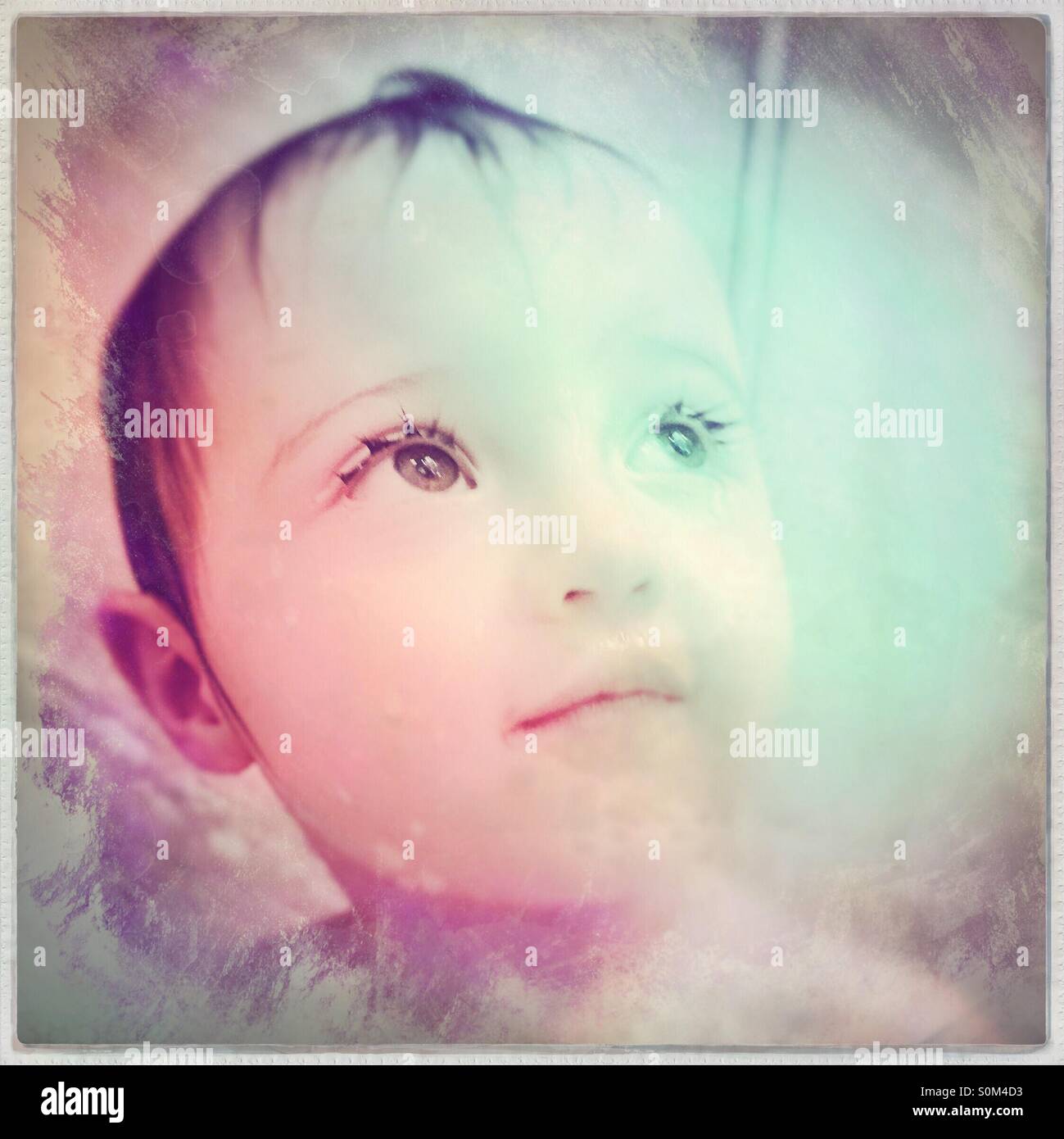 Baby with beautiful eyes looking up Stock Photo Alamy