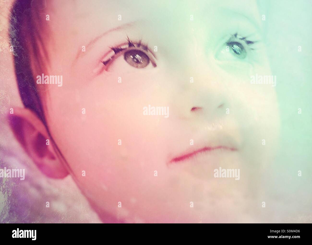 Baby with beautiful eyes looking up Stock Photo Alamy