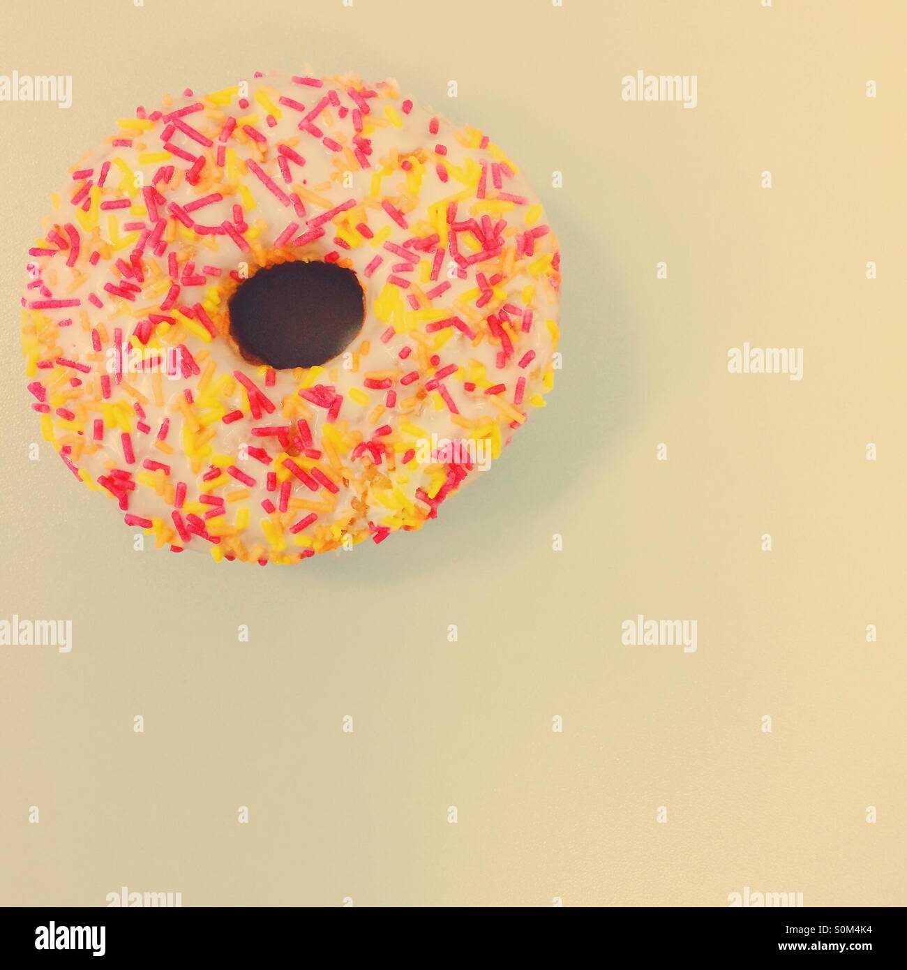 Single ring doughnut with multicoloured sprinkles Stock Photo Alamy