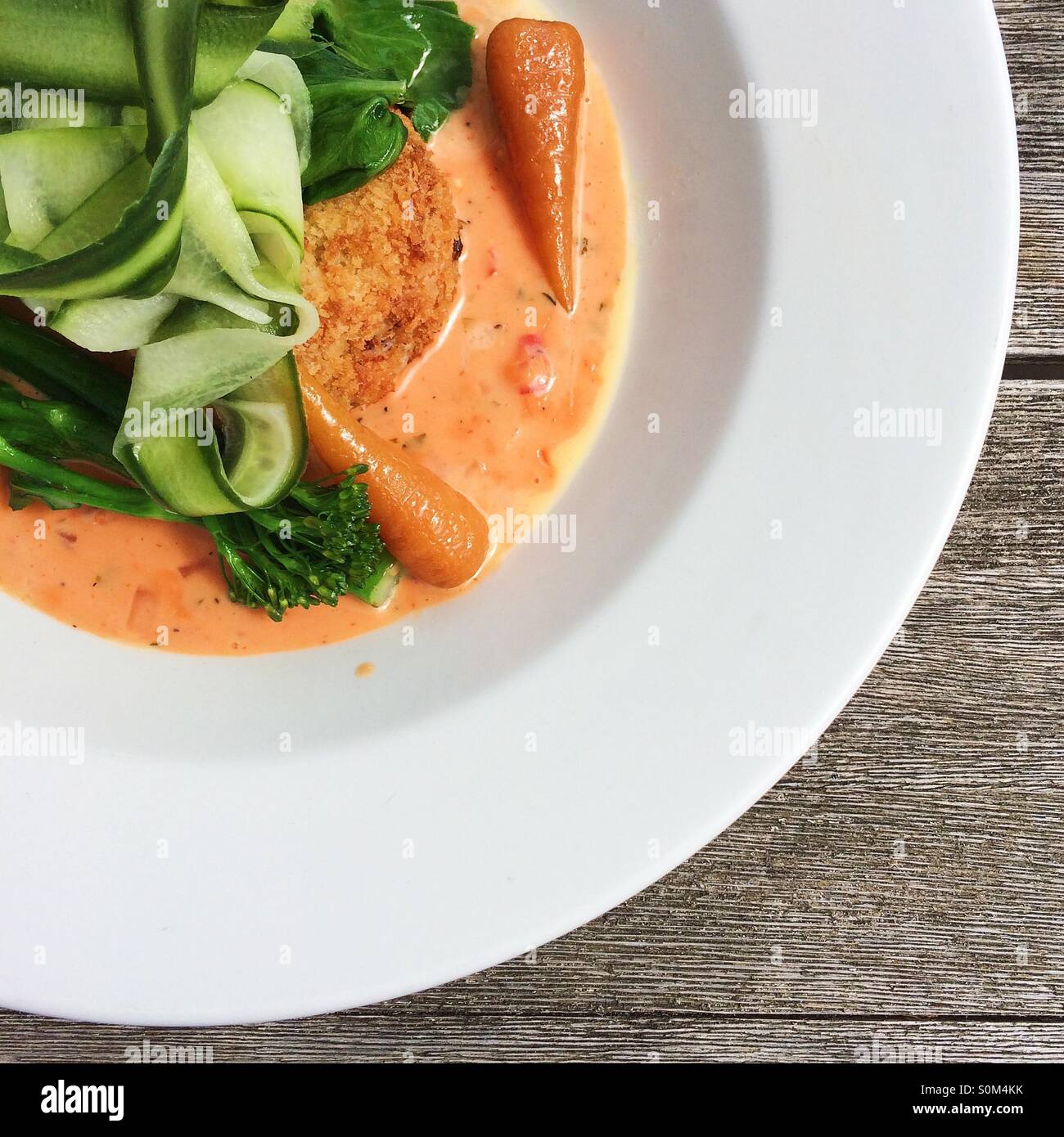 Salmon fish cake, pickled cucumber and sweet chilli sauce - Smartphone Captured Stock Image