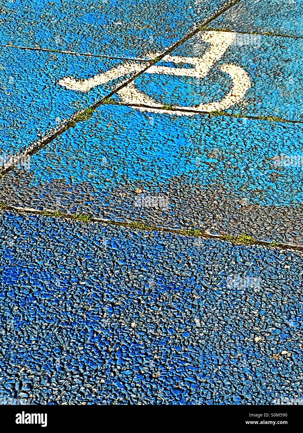 Wheelchair sign on reserved parking space. Handicapped disabled sign - Smartphone Captured Stock Image