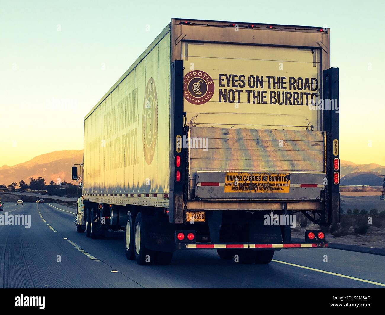 A Chipotle Mexican Grill delivery truck reminds drivers to keep their