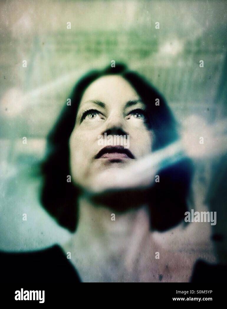 Portrait of woman looking up - Smartphone Captured Stock Image