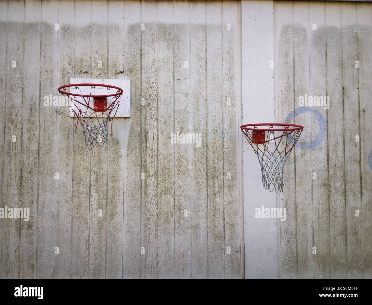2 basket ball hoops on wall - Smartphone Captured Stock Image
