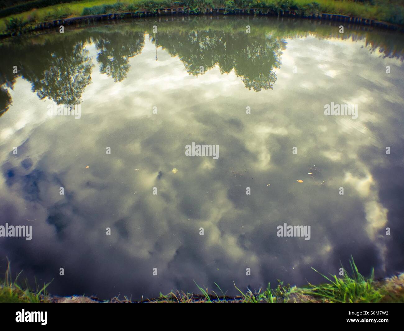 Cloudy Grey reflections in the water - Smartphone Captured Stock Image