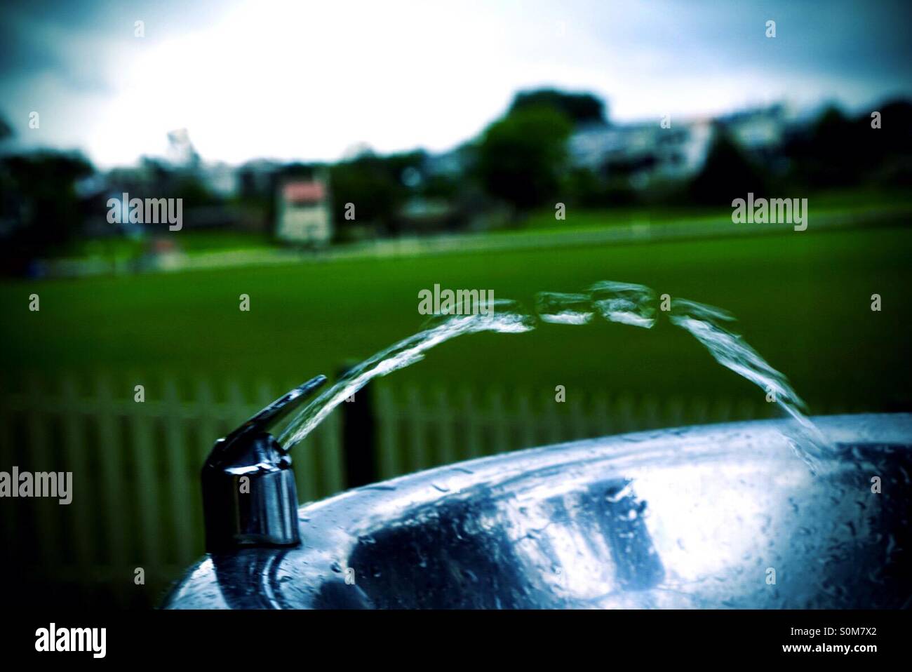 Water spraying from faucet Stock Photo Alamy