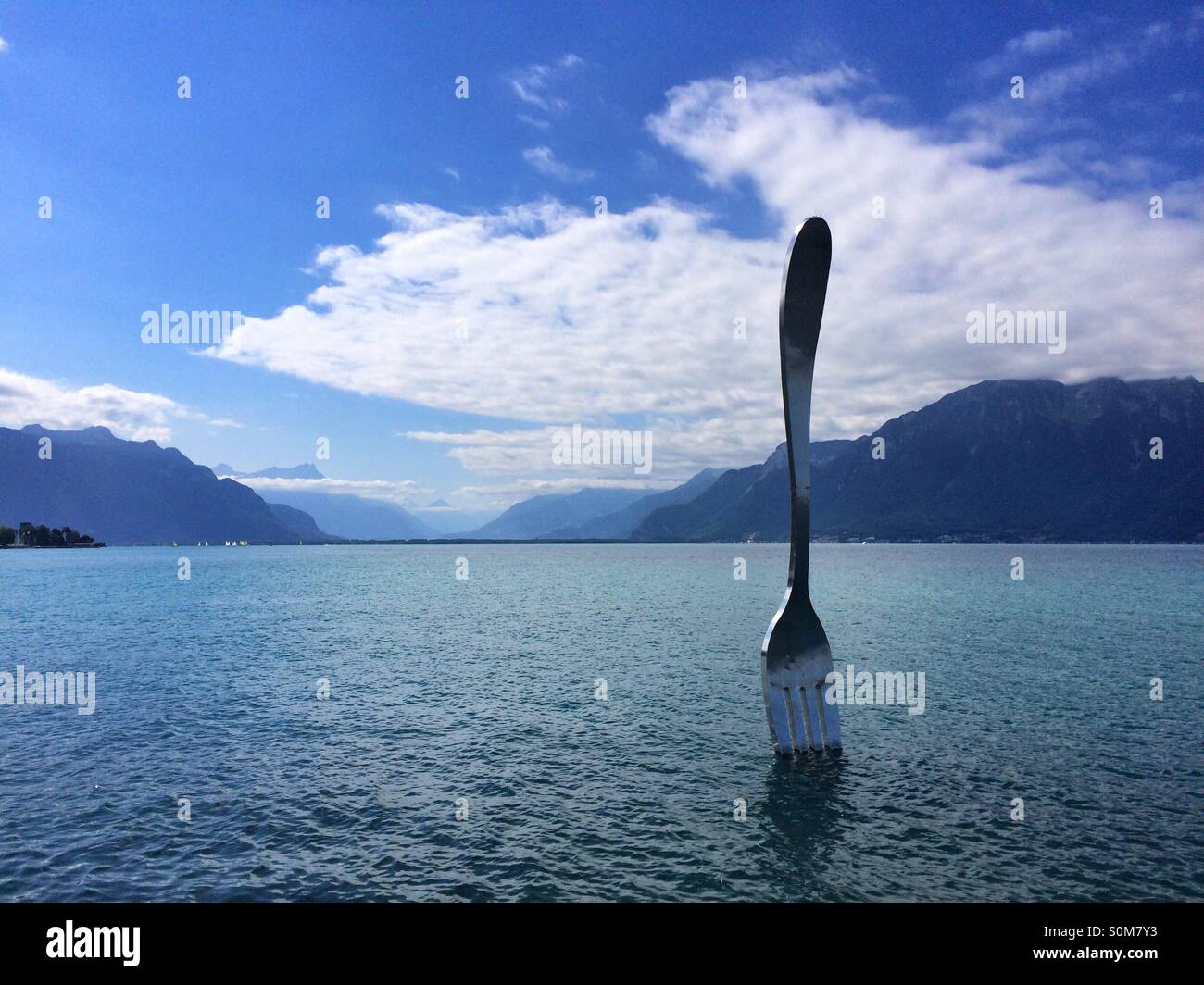 Giant steel fork in water of Geneva Lake, Vevey,Switzerland - Smartphone Captured Stock Image