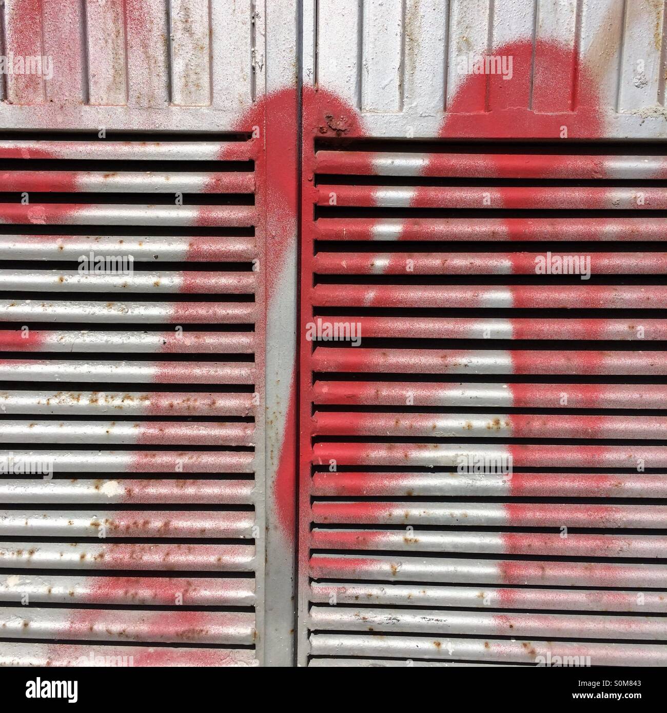 Graffiti on ventilation grill Stock Photo