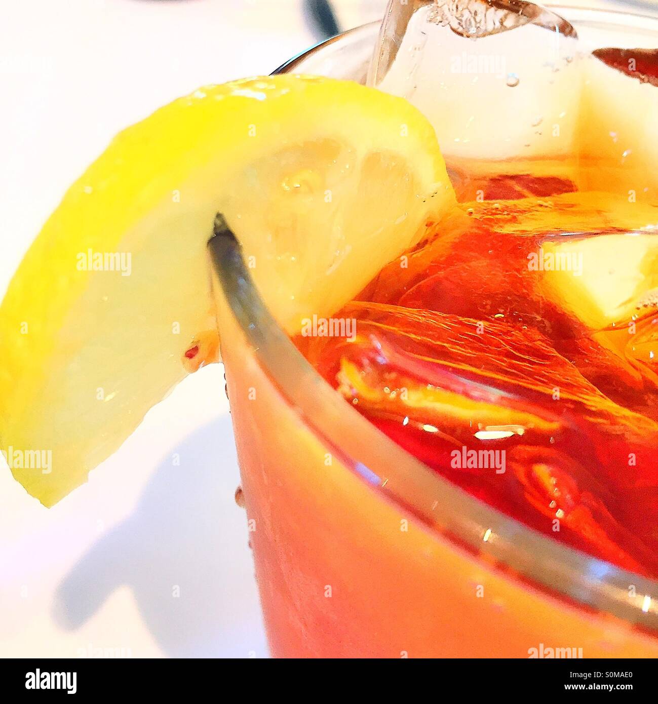 Iced tea Glass with ice cubes and lemon wedge Stock Photo Alamy