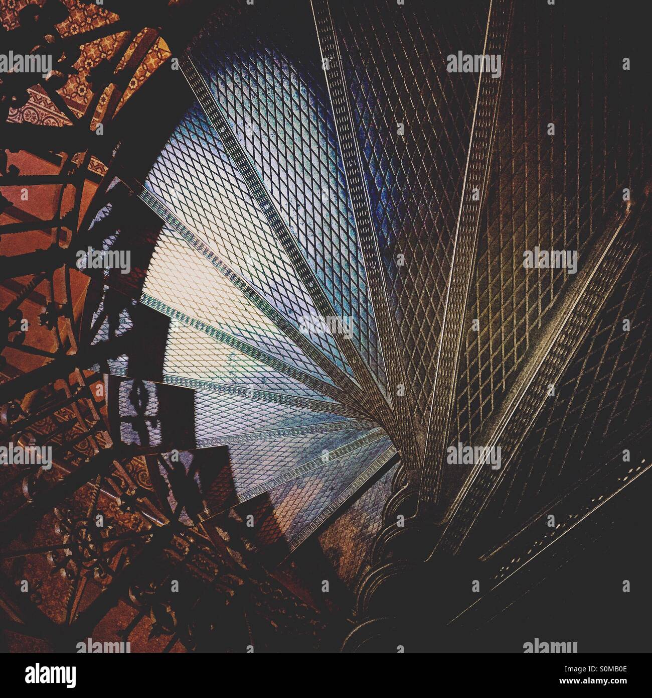 Top view of a metal winding staircase. Spiral staircase. - Smartphone Captured Stock Image