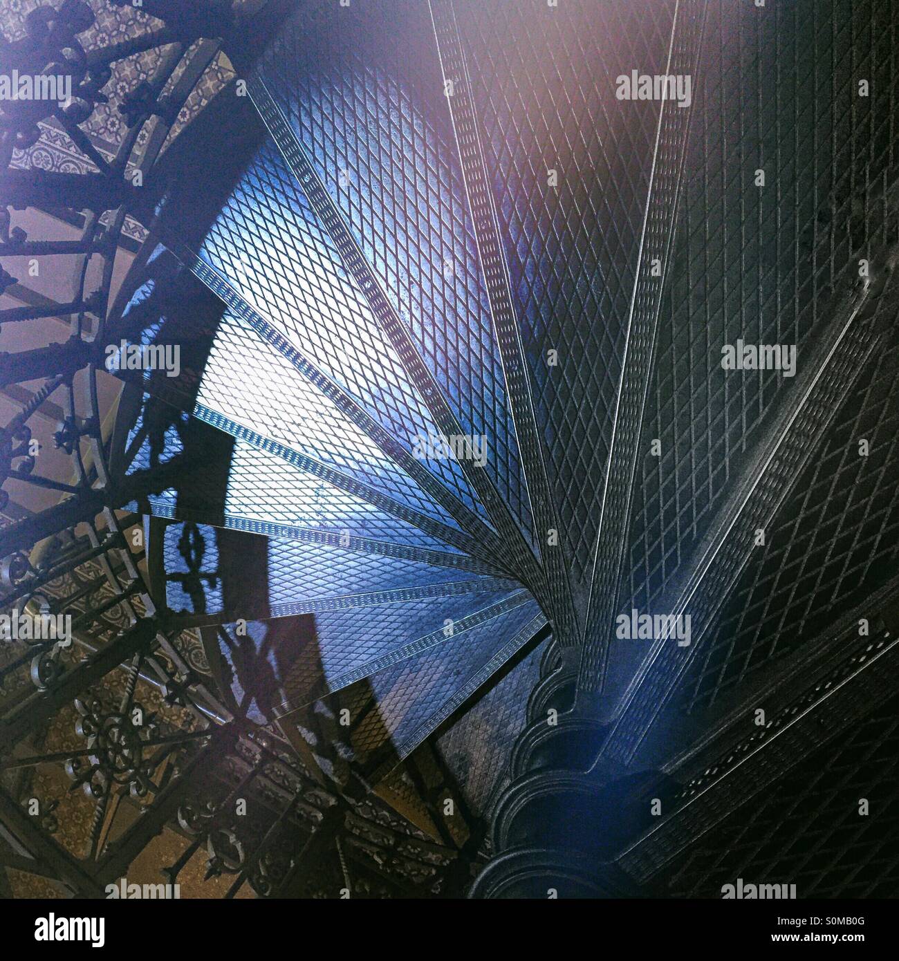 Top view of a metal winding staircase. Spiral staircase. - Smartphone Captured Stock Image