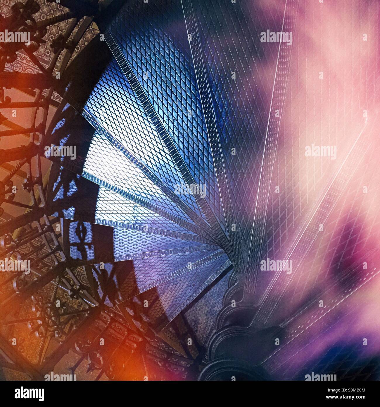 Top view of a metal winding staircase. Spiral staircase. - Smartphone Captured Stock Image