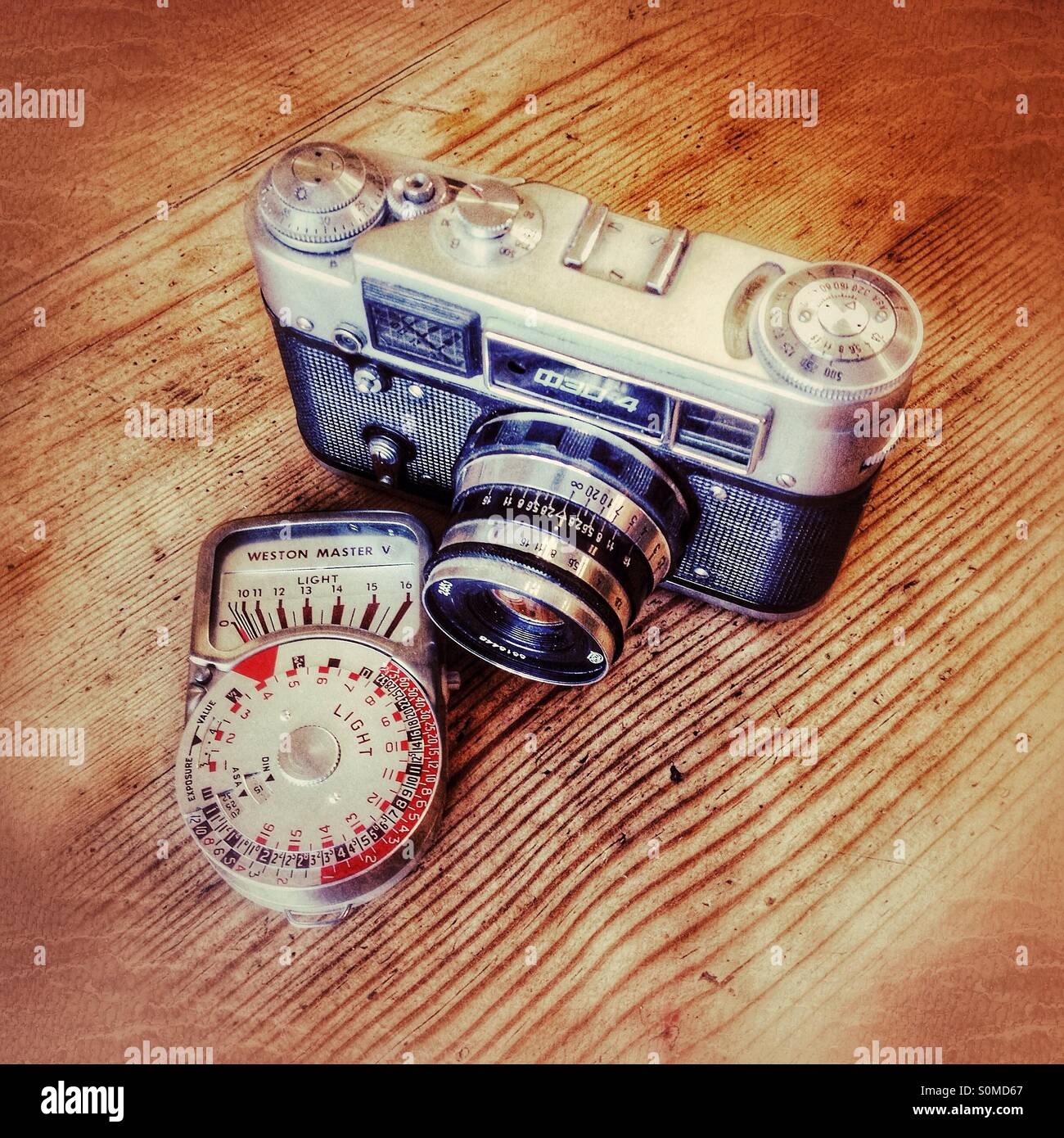 Old Russian FED4 film camera and Weston light meter - Smartphone Captured Stock Image