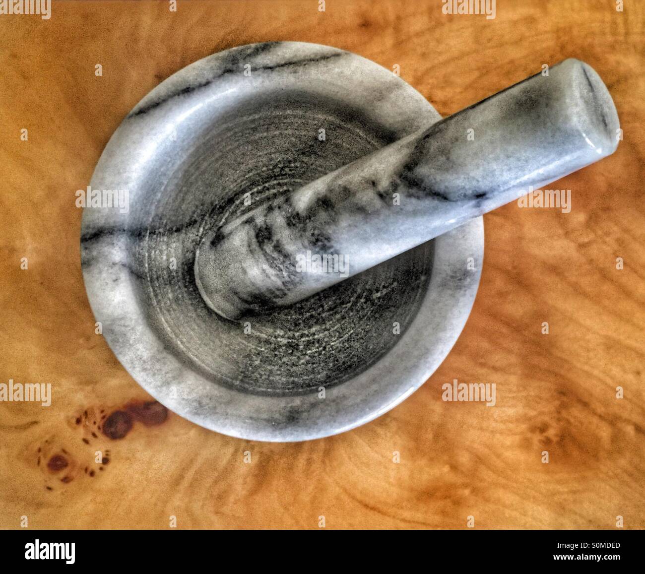 Marble mortar and pestle on wooden table Stock Photo Alamy