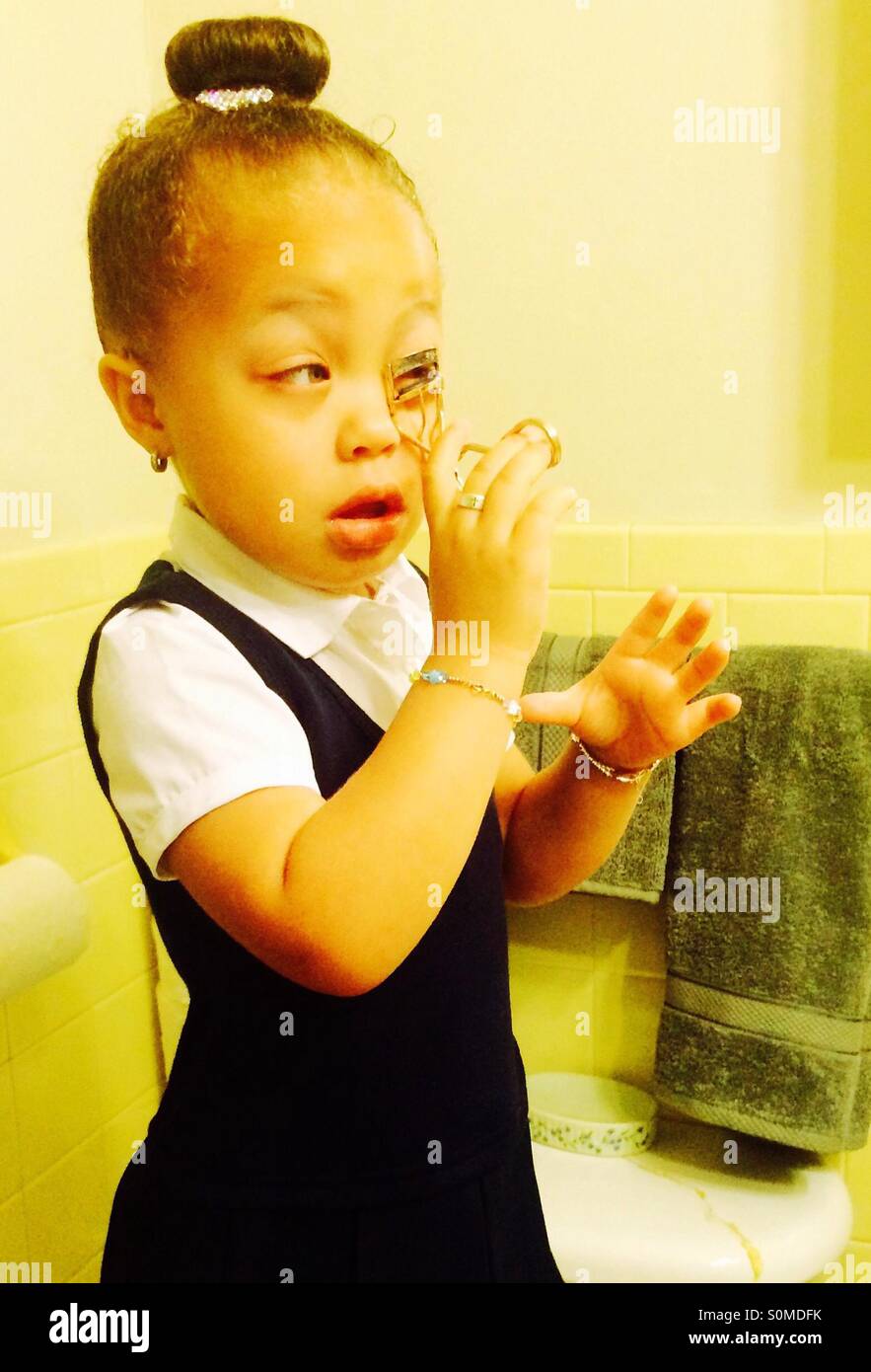 baby playing with makeup