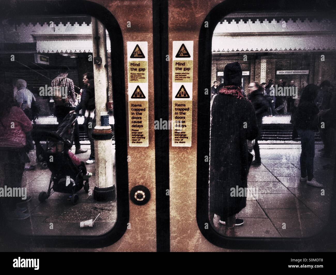 Looking through the door windows on a London Underground train. - Smartphone Captured Stock Image