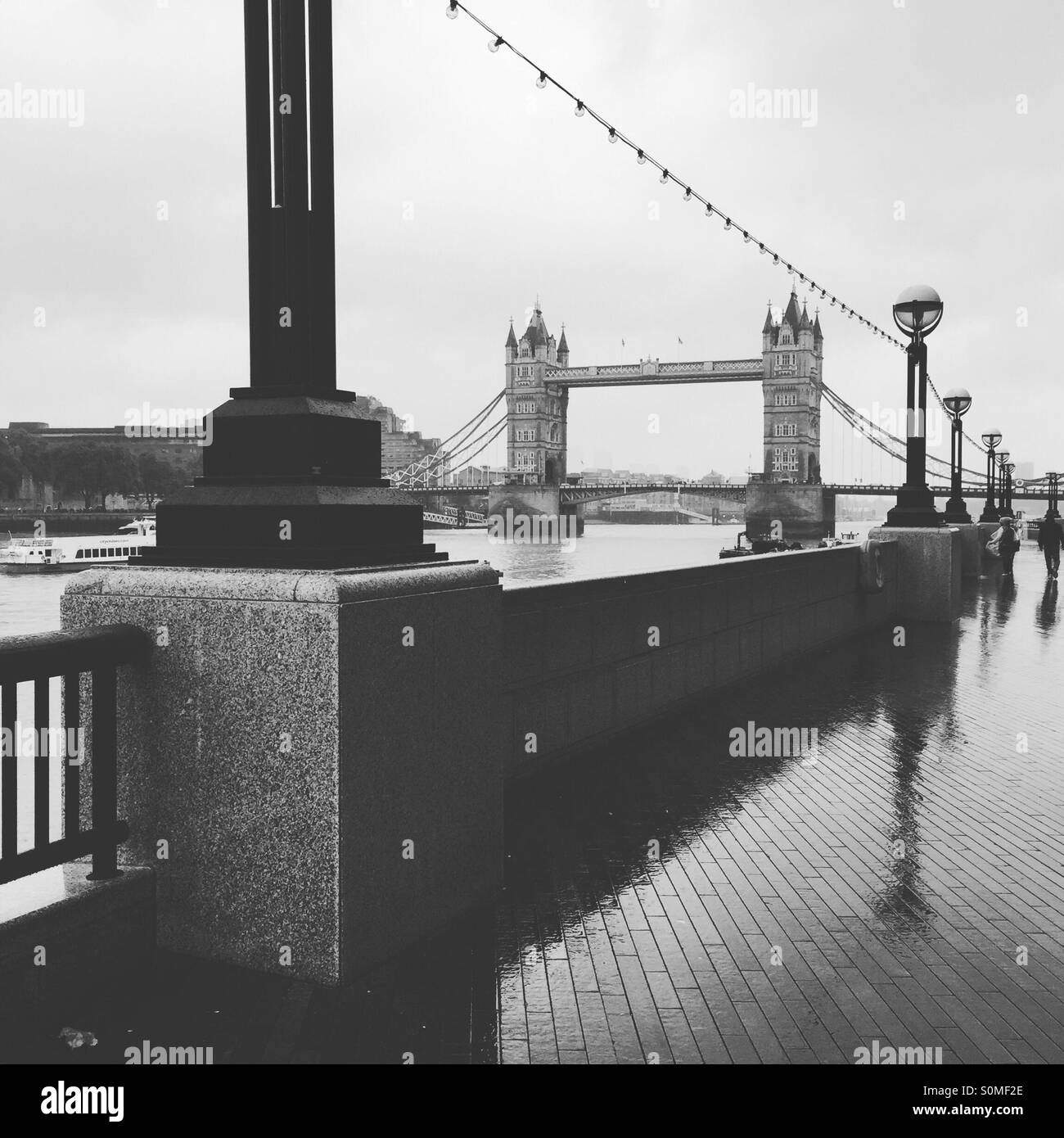 Rainy day reflections at Tower Bridge Stock Photo